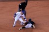 Miami Marlins' Jon Berti (5) steals second ahead of the attempted tag by Chicago Cubs second baseman Jason Kipnis as umpire Dan Iassogna (58) looks on in the eighth inning of Game 1 of a National League wild-card baseball series in Chicago, Wednesday, Sept. 30, 2020. (AP Photo/Nam Y. Huh)