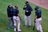 A member of the Miami Marlins staff, left, manager Don Mattingly, second from right, and Jesus Aguilar (24) all check on Starling Marte (6) after Marte was hit by a pitch thrown by Chicago Cubs' Dan Winkler in the ninth inning of Game 1 of a National League wild-card baseball series in Chicago, Wednesday, Sept. 30, 2020. Marte left the game with an unknown injury. (AP Photo/Nam Y. Huh)