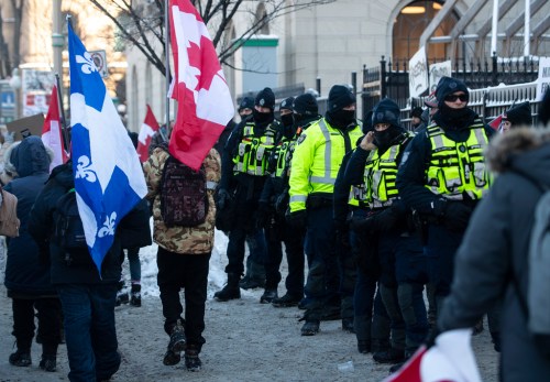 CP
First responders including Ottawa Police and Fire stand along Wellington Street as people participate in a rally against COVID-19 restrictions on Parliament Hill, which began as a cross-country convoy protesting a federal vaccine mandate for truckers, in Ottawa, on Saturday, Jan. 29, 2022. THE CANADIAN PRESS/Justin Tang