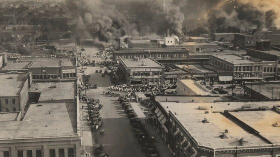 CPCrowds watch fires during the Tulsa Race Massacre on June 1, 1921. (The University of Tulsa via The Associated Press files)