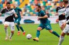AC Milan's Hakan Calhanoglu goes for the ball during the Serie A soccer match between Udinese and AC Milan, at the Dacia Arena Stadium in Udine, Italy, Sunday, Nov. 1, 2020. (Andrea Bressanutti/LaPresse via AP)