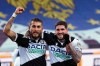 Udinese's Roberto Pereyra, left, celebrates with teammate Rodrigo de Paul after scoring their side's second goal during a Serie A soccer match between Udinese and Sassuolo, in Udine's Friuli stadium, Italy, Saturday, March 6, 2021. (Andrea Bressanutti/LaPresse via AP)