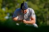 Bryson DeChambeau, of the United States, lines up a putt on the 14th green during the final round of the US Open Golf Championship, Sunday, Sept. 20, 2020, in Mamaroneck, N.Y. (AP Photo/John Minchillo)