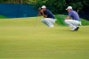 Tiger Woods, of the United States, left and Justin Thomas, of the United States, line up their putts on the third green during the first round of the US Open Golf Championship, Thursday, Sept. 17, 2020, in Mamaroneck, N.Y. (AP Photo/John Minchillo)