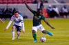 Portland Timbers forward Yimmi Chara (23) shoots as Vancouver Whitecaps midfielder Russell Teibert (31) looks on in the first half during an MLS soccer game Sunday, April 18, 2021, in Sandy, Utah. (AP Photo/Rick Bowmer)