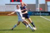 North Carolina Courage's Samantha Mewis, rear, passes the ball as Portland Thorns FC forward Tyler Lussi, left, defends during the first half of an NWSL Challenge Cup soccer match at Zions Bank Stadium Friday, July 17, 2020, in Herriman, Utah. (AP Photo/Rick Bowmer)
