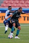 Vancouver Whitecaps forward Cristian Dajome, left, defends against LA Galaxy midfielder Victor Vazquez during the first half of an MLS soccer match Saturday, July 17, 2021, in Sandy, Utah. (AP Photo/Rick Bowmer)
