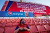 A fan sits in the stands after the scheduled game between Real Salt Lake and Los Angeles FC was postponed Wednesday, Aug. 26, 2020, in Sandy, Utah. Major League Soccer players boycotted five games Wednesday night in a collective statement against racial injustice. The players' action came after all three NBA playoff games were called off in a protest over the police shooting of Jacob Blake in Wisconsin on Sunday night. (AP Photo/Rick Bowmer)