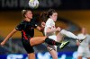 Portland Thorns defender Kelli Hubly, left, and Washington Spirit midfielder Rose Lavelle (10) vie for the ball during the second half of an NWSL Challenge Cup soccer match at Zions Bank Stadium on Sunday, July 5, 2020, in Herriman, Utah. (AP Photo/Rick Bowmer)