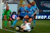 Reign's Kristen McNabb, foreground, kicks the ball as Chicago Red Stars' Julie Ertz, center, and Vanessa DiBernardo, right, defend during the first half of an NWSL Challenge Cup soccer match at Zions Bank Stadium, Saturday, July 18, 2020, in Herriman, Utah. (AP Photo/Rick Bowmer)