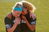 Chicago Red Stars' Julie Ertz, left, holds Casey Short after players for their team knelt during the national anthem before an NWSL Challenge Cup soccer match against the Washington Spirit at Zions Bank Stadium, Saturday, June 27, 2020, in Herriman, Utah. (AP Photo/Rick Bowmer)