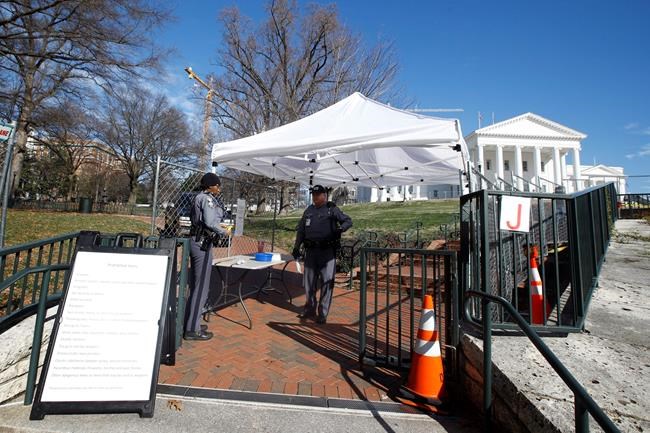 Fencing and magnetometers are set up around Capitol Square for the anticipated pro gun rally at the Virginia State Capitol Sunday, Jan. 19, 2020, in Richmond, Va. (AP Photo/Steve Helber)