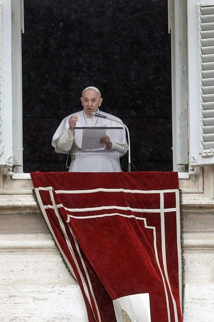 FILE - In this Feb. 7, 2021 file photo, Pope Francis recites the Angelus prayer from his studio window overlooking St. Peter's Square, at the Vatican. Pope Francis urged governments on Monday, Feb. 8, 2021, to use the coronavirus crisis as an opportunity to create a world that is more economically and environmentally just _ and where basic health care is guaranteed for all. (AP Photo/Gregorio Borgia, file)