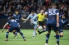 Sporting Kansas City's Alan Pulido, centre, takes a shot on goal past Vancouver Whitecaps' Jasser Khmiri, back right, as Inbeom Hwang, back left looks on during the first half of an MLS soccer game in Vancouver, B.C., Saturday, Feb. 29, 2020. THE CANADIAN PRESS/Darryl Dyck