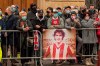 People who were not able to enter the church for the funeral service of Paolo Rossi wait outside, in Vicenza, Italy, Saturday, Dec. 12, 2020. Paolo Rossi, who led Italy to the 1982 World Cup title and later worked as a soccer commentator in his home country, died at the age of 64. (Paola Garbuio/LaPresse via AP)