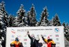 Bobsleigh pilot Kaillie Humphries of the United States, center, celebrates on the podium after taking first place in the women's monobob race at the Bobsleigh and Skeleton World Championships in Altenberg, Germany, Sunday, Feb.14, 2021. At left is second place Germany's Stephanie Schneider and at right is third place Germany's Laura Nolte. (AP Photo/Matthias Schrader)