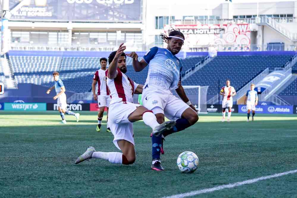 Valour defender Federico Pena makes a sliding tackle in Wednesday’s 2-0 victory over HFX Wanderers FC. (Robert Reyes Ong)