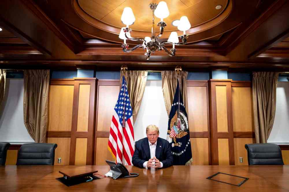 The memorandum from White House physician Sean Conley to White House press secretary Kayleigh McEnany with information about President Donald Trump receiving a single 8 gram dose of Regeneron's polyclonal antibody cocktail on Friday, Oct. 2, 2020. (AP Photo/Jon Elswick)