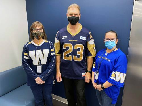 WAA employees wearing their Winnipeg Blue Bomber jerseys to work during the team’s playoff run.