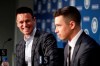 Seattle Mariners general manager Jerry Dipoto, left, looks on at pitcher Marco Gonzales during a baseball news conference Tuesday, Feb. 4, 2020, in Seattle. Gonzales and the Mariners agreed to a $30 million contract covering 2021-24, a deal that includes a club option and could be worth $45 million over five seasons. Gonzales is coming off the best season of his career. (AP Photo/Elaine Thompson)