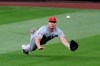 Los Angeles Angels center fielder Mike Trout dives for, but misses, a fly ball from Seattle Mariners' J.P. Crawford for a single in the third inning of a baseball game Wednesday, Aug. 5, 2020, in Seattle. (AP Photo/Elaine Thompson)