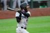 Colorado Rockies' Charlie Blackmon watches his three-run double against the Seattle Mariners during the fifth inning of a baseball game Saturday, Aug. 8, 2020, in Seattle. (AP Photo/Elaine Thompson)