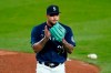 Seattle Mariners starting pitcher Taijuan Walker claps his hands as he heads off the mound after throwing in the seventh inning of a baseball game against the Los Angeles Dodgers, Wednesday, Aug. 19, 2020, in Seattle. (AP Photo/Elaine Thompson)