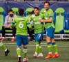 Seattle Sounders' Raul Ruidiaz (9) is congratulated after scoring for the Sounders in the 12th minute of an MLS soccer match against LAFC, Sunday, Aug. 30, 2020, in Seattle. (Dean Rutz/The Seattle Times via AP)