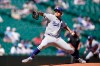 Los Angeles Dodgers starting pitcher Julio Urias throws against the Seattle Mariners in the first inning of a baseball game Tuesday, April 20, 2021, in Seattle. (AP Photo/Ted S. Warren)