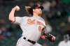 Baltimore Orioles starting pitcher Dean Kremer throws against the Seattle Mariners during the first inning of a baseball game, Monday, May 3, 2021, in Seattle. (AP Photo/Ted S. Warren)