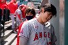 Los Angeles Angels Shohei Ohtani heads into the clubhouse at the end of the top of the first inning after being hit by a pitch but staying in the baseball game against the Seattle Mariners, Sunday, May 2, 2021, in Seattle. (AP Photo/Ted S. Warren)
