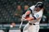 Seattle Mariners' Kyle Seager breaks his bat as he singles against the San Francisco Giants during the fifth inning of a baseball game Saturday, April 3, 2021, in Seattle. (AP Photo/Ted S. Warren)