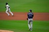 New York Yankees' Gleyber Torres, left, rounds the bases Tampa Bay Rays relief pitcher Ryan Yarbrough (48) watches after Torres hit a two-run home run during the sixth inning to score Brett Gardner in Game 4 of a baseball American League Division Series Thursday, Oct. 8, 2020, in San Diego. (AP Photo/Gregory Bull)