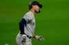 New York Yankees' Giancarlo Stanton rounds the bases after he hit a three-run home run to score Luke Voit and Aaron Hicks during the fourth inning in Game 2 of a baseball American League Division Series against the Tampa Bay Rays, Tuesday, Oct. 6, 2020, in San Diego. (AP Photo/Gregory Bull)