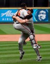 Baltimore Orioles starting pitcher John Means, right, celebrates with catcher Pedro Severino after Means threw a no-hitter baseball game against the Seattle Mariners, Wednesday, May 5, 2021, in Seattle. The Orioles won 6-0. (AP Photo/Ted S. Warren)