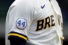 A patch to honor Hank Aaron is seen on the sleeve of Milwaukee Brewers' Keston Hiura during the first inning of an Opening Day baseball game against the Minnesota Twins Thursday, April 1, 2021, in Milwaukee. (AP Photo/Aaron Gash)