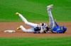 Milwaukee Brewers' Christian Yelich collides with Kansas City Royals' Nicky Lopez after being tagged out at second base during the first inning of a baseball game Sunday, Sept. 20, 2020, in Milwaukee. (AP Photo/Aaron Gash)