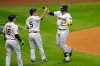 Milwaukee Brewers' Jacob Nottingham (26) celebrates with teammates after hitting a grand slam during the fourth inning of a baseball game against the Kansas City Royals, Friday, Sept. 18, 2020, in Milwaukee. (AP Photo/Aaron Gash)
