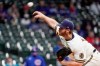 Milwaukee Brewers starting pitcher Brandon Woodruff throws during the first inning of a baseball game against the Chicago Cubs Tuesday, April 13, 2021, in Milwaukee. (AP Photo/Morry Gash)