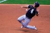 Chicago White Sox's Nick Madrigal races to third during the third inning of a baseball game against the Milwaukee Brewers Tuesday, Aug. 4, 2020, in Milwaukee. Madrigal tried to advance from first on a hit by Luis Robert. (AP Photo/Morry Gash)