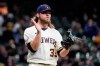 Milwaukee Brewers' Corbin Burnes reacts after getting Miami Marlins' Sandy Leon to strike out during the fifth inning of a baseball game Monday, April 26, 2021, in Milwaukee. (AP Photo/Morry Gash)