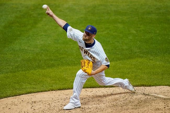 Milwaukee Brewers relief pitcher David Phelps throws during the seventh inning of a baseball game against the Pittsburgh Pirates Friday, Aug. 28, 2020, in Milwaukee. (AP Photo/Morry Gash)