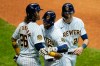 Milwaukee Brewers' Ryan Braun celebrates his three-run home run with Jacob Nottingham (26) and Christian Yelich during the eighth inning of a baseball game against the Kansas City Royals Saturday, Sept. 19, 2020, in Milwaukee. (AP Photo/Morry Gash)