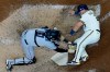 Miami Marlins catcher Chad Wallach tags out Milwaukee Brewers' Daniel Vogelbach at home during the sixth inning of a baseball game Wednesday, April 28, 2021, in Milwaukee. (AP Photo/Morry Gash)