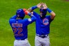 Chicago Cubs' Jason Heyward is congratulated by Javier Baez after hitting a three-run home run during the ninth inning of a baseball game against the Milwaukee Brewers Saturday, Sept. 12, 2020, in Milwaukee. (AP Photo/Morry Gash)