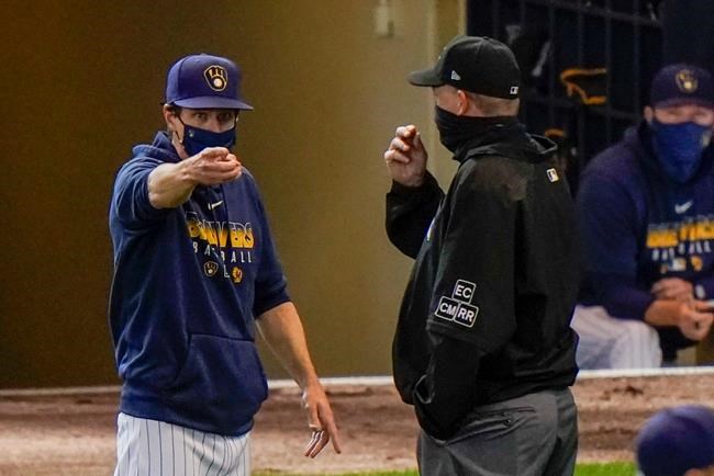 Milwaukee Brewers mahanger Craig Counsell argues with umpire Ron Kulpa during the fifth inning of a baseball game against the Chicago Cubs Sunday, Sept. 13, 2020, in Milwaukee. (AP Photo/Morry Gash)