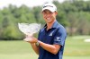 Collin Morikawa holds his trophy after winning the Workday Charity Open golf tournament, Sunday, July 12, 2020, in Dublin, Ohio. (AP Photo/Darron Cummings)