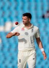 FILE - In this file photo dated Friday, Dec. 27, 2019, England's bowler James Anderson prepares to bowl on day two of the first cricket test match between South Africa and England at Centurion Park, Pretoria, South Africa. England fast bowler James Anderson Thursday June 11, 2020, has praised the West Indies for making a “scary decision” to travel to Britain for the three-test cricket series between the teams during the coronavirus pandemic. (AP Photo/Themba Hadebe, FILE)