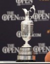 FILE - In this file photo dated Sunday, July 21, 2019, The Claret Jug trophy for The Open golf tournament, seen during a press conference for the British Open Golf Championships at Royal Portrush in Northern Ireland. British Open organizers said Wednesday Feb. 10, 2021, they have “cautious optimism” despite the coronavirus, that golf’s oldest major will go ahead at Royal St. George’s course at Sandwich in southeast England in July 2021. (AP Photo/Peter Morrison, FILE)