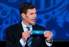 FILE - In this file photo dated Saturday, Nov. 26, 2016, Zvonimir Boban, FIFA's Deputy Secretary General for Football, holds the lot of Chile during the draw for the soccer Confederations Cup 2017, in Kazan, Russia. Former Croatia and AC Milan great Zvonimir Boban is returning to top level soccer politics as an advisor to UEFA president Aleksander Ceferin according to an announcement Friday April 16, 2021.(AP Photo/Ivan Sekretarev, FILE)